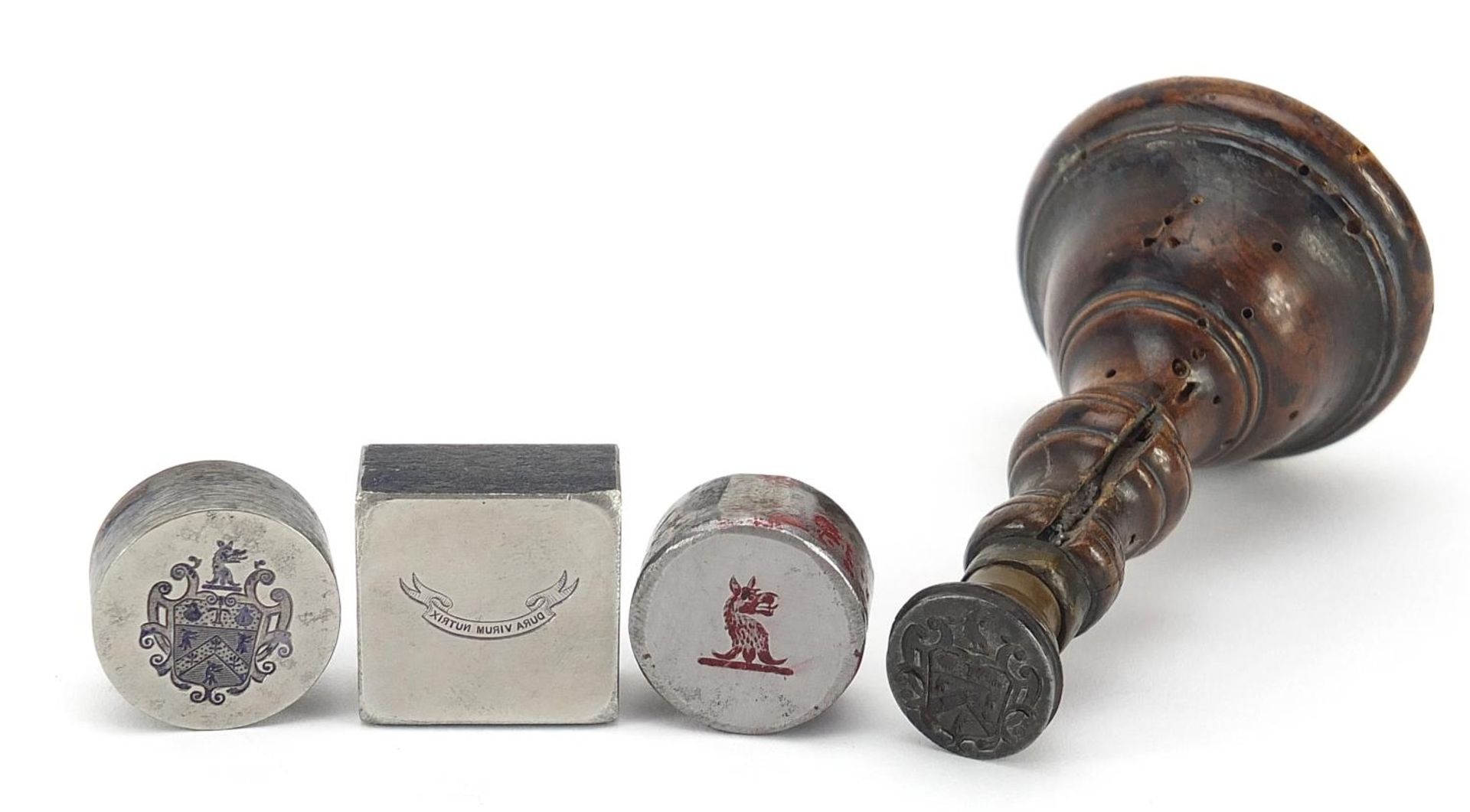Four antique steel wax and ink seals including one with turned treen handle, the largest 8.5cm in