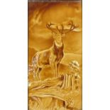 Large Victorian treacle glazed tile hand painted with a stag, framed, the tile 29cm x 14.5cm