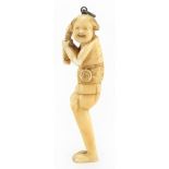 Good Japanese carved ivory netsuke of a man, signed with character marks to the reverse, 8cm high