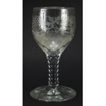 Large 18th century glass goblet with facetted stem etched with leaves and berries, 25cm high