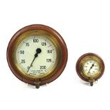 Two vintage Dewrance of London brass pressure gauges with oak backs, the largest 25.5cm in diameter