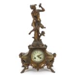 Patinated spelter and onyx mantle clock surmounted with a female, the enamelled dial having Arabic