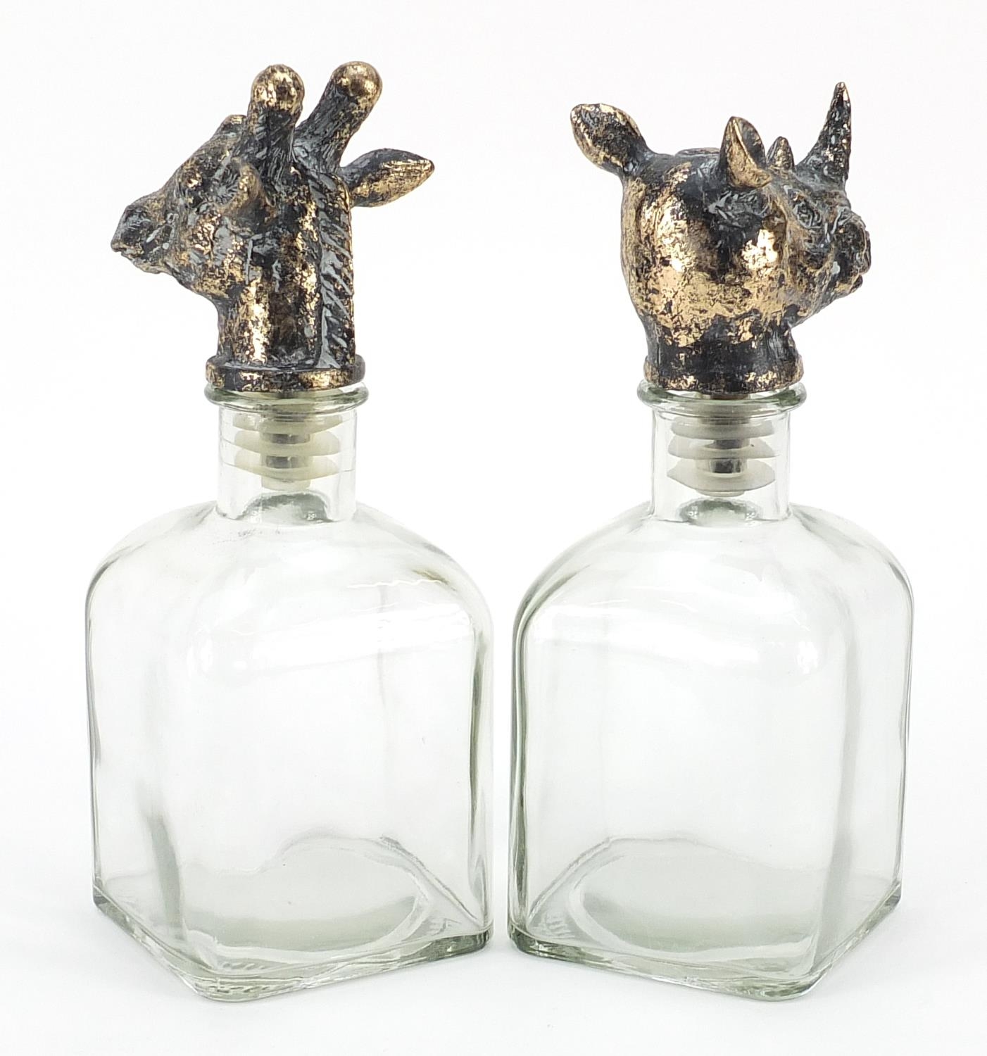 Pair of glass decanters with bronzed rhinoceros and giraffe head stoppers, the largest 24.5cm high - Image 2 of 3