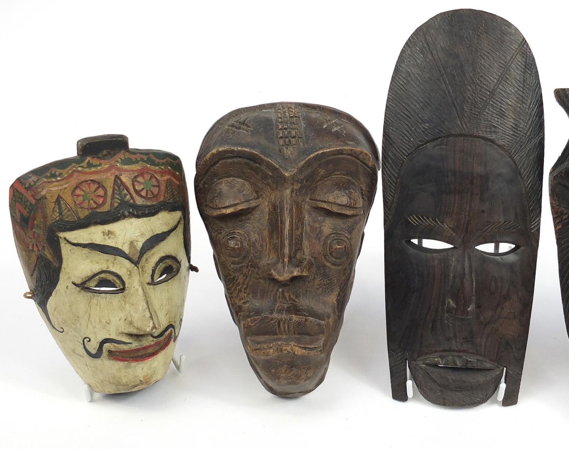 Six tribal interest carved wood face masks, the largest 31cm high - Image 2 of 4