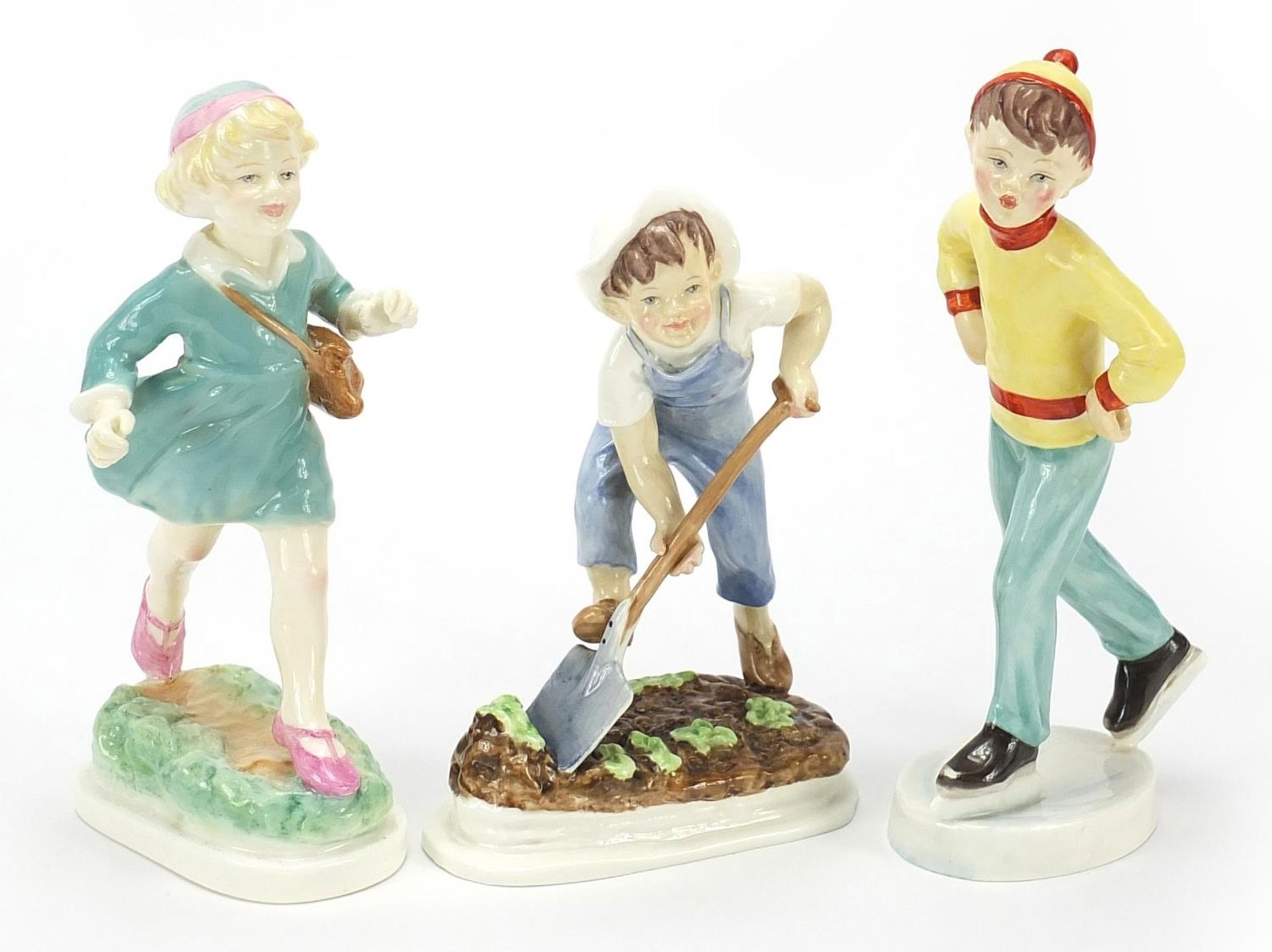 Three Royal Worcester figures comprising Saturday's Child Works Hard for a Living, Thursday's