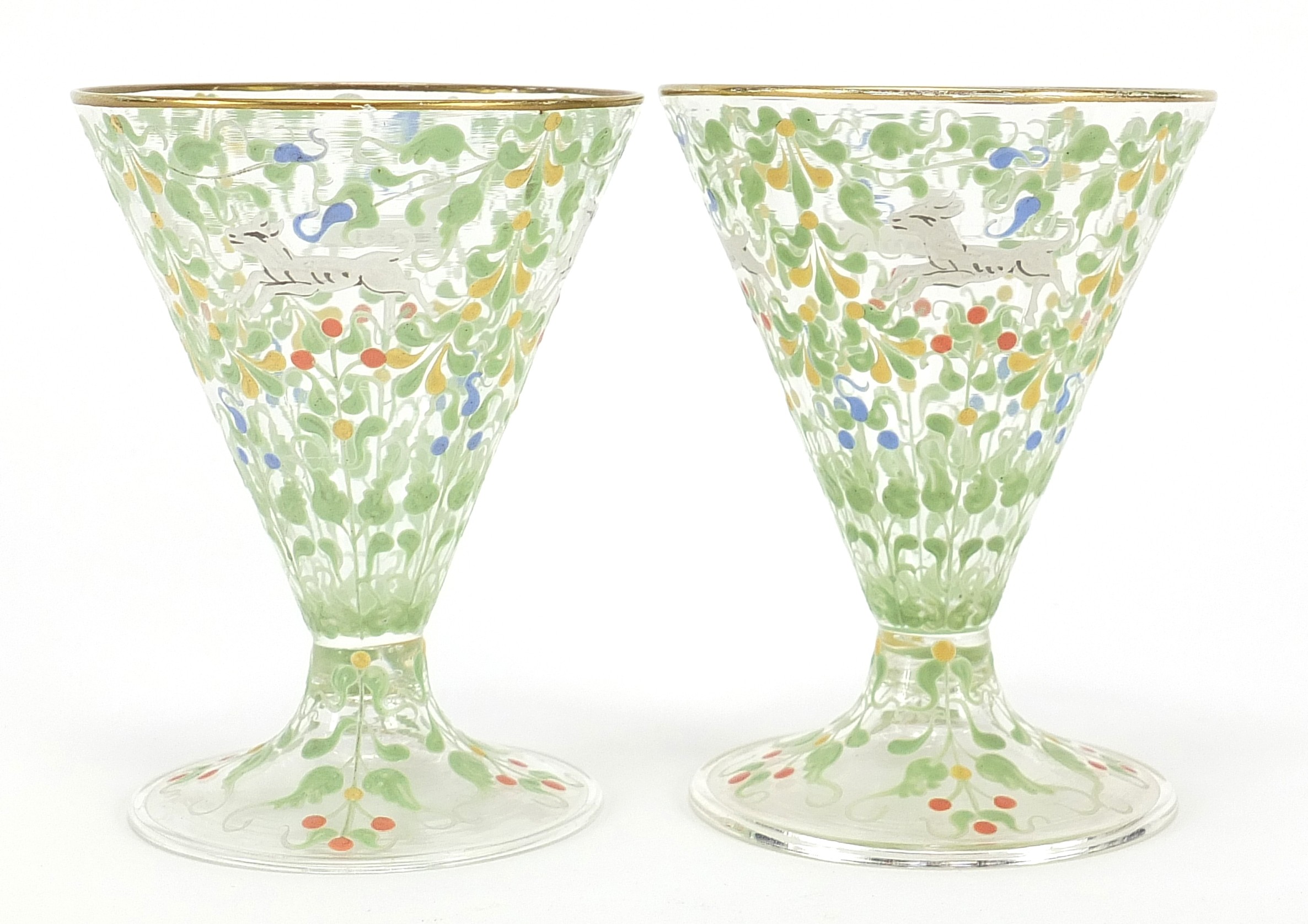 Pair of Bohemian cocktail glasses in the manner of Moser, each enamelled with wild animals amongst