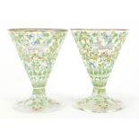 Pair of Bohemian cocktail glasses in the manner of Moser, each enamelled with wild animals amongst