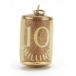 9ct gold emergency ten shilling note charm, 2.6cm high, 2.4g