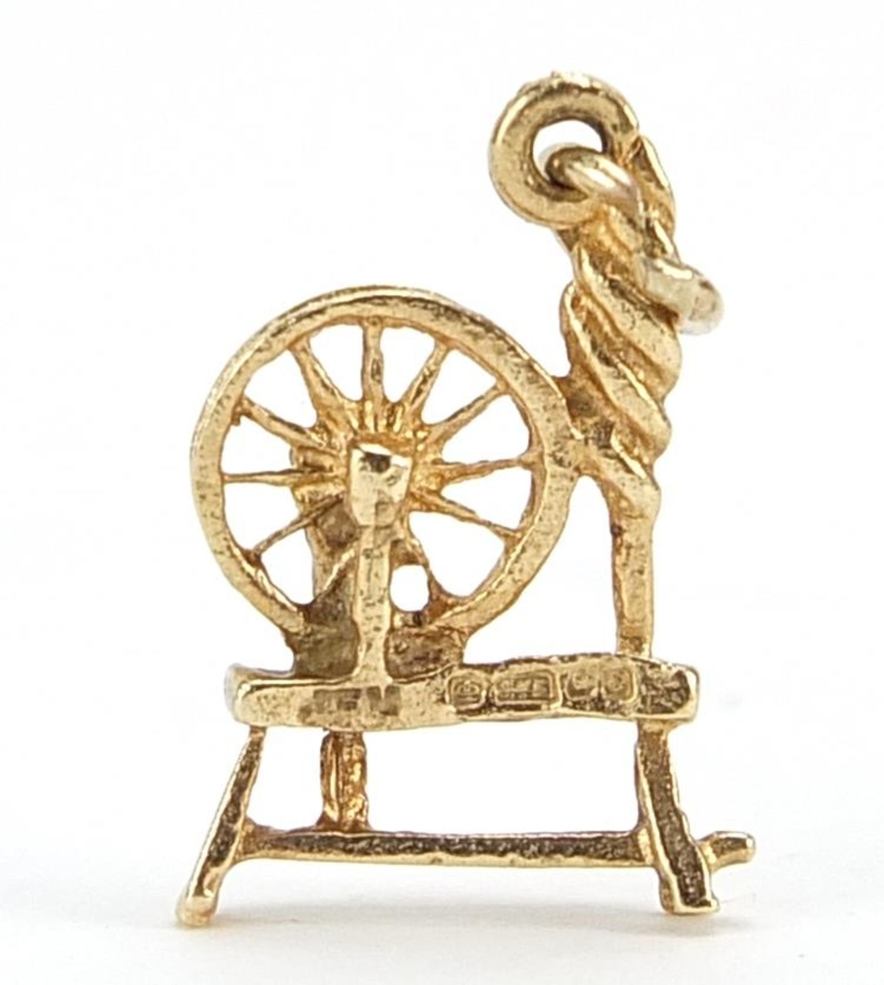 9ct gold spinning wheel charm, 1.8cm high, 1.2g