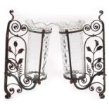 Pair of Arts & Crafts style wrought iron wall lights with frilled glass shades, each 55.5cm high