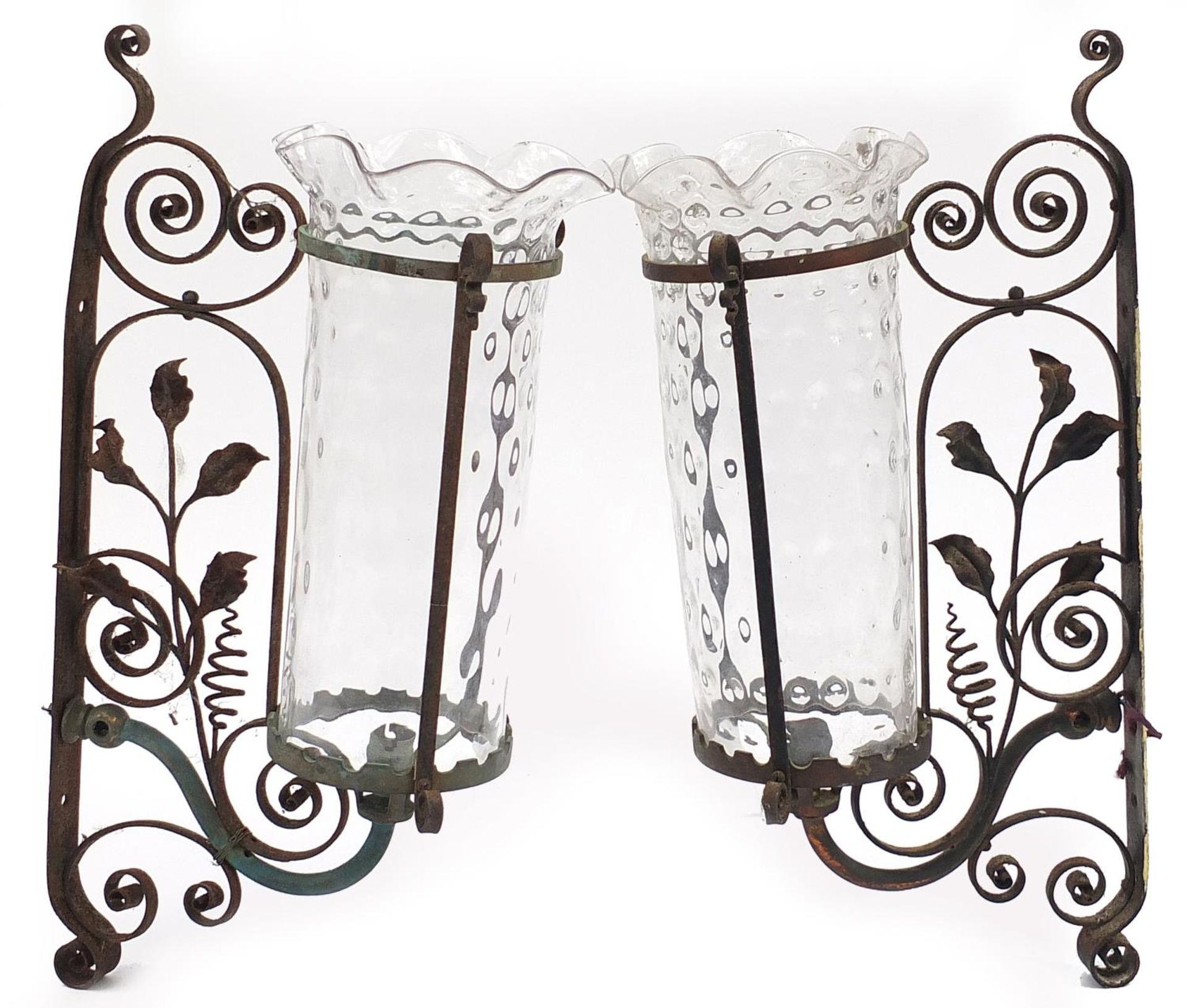 Pair of Arts & Crafts style wrought iron wall lights with frilled glass shades, each 55.5cm high