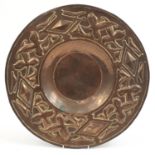 Arts & Crafts copper charger in the manner of Keswick embossed with stylised foliage, 46cm in