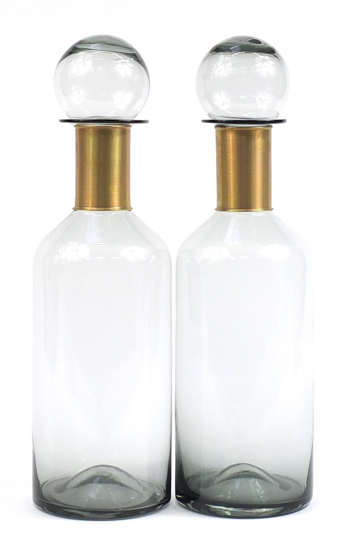 Pair of large smoky glass apothecary style jars with measure lids, 53cm high