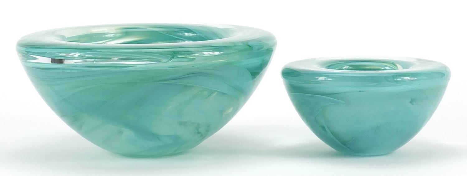 Kosta Boda, two Scandinavian green smoky glass bowls, the largest 17cm in diameter