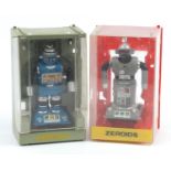 Two vintage Zeroids robots with cases, the largest box 21.5cm high