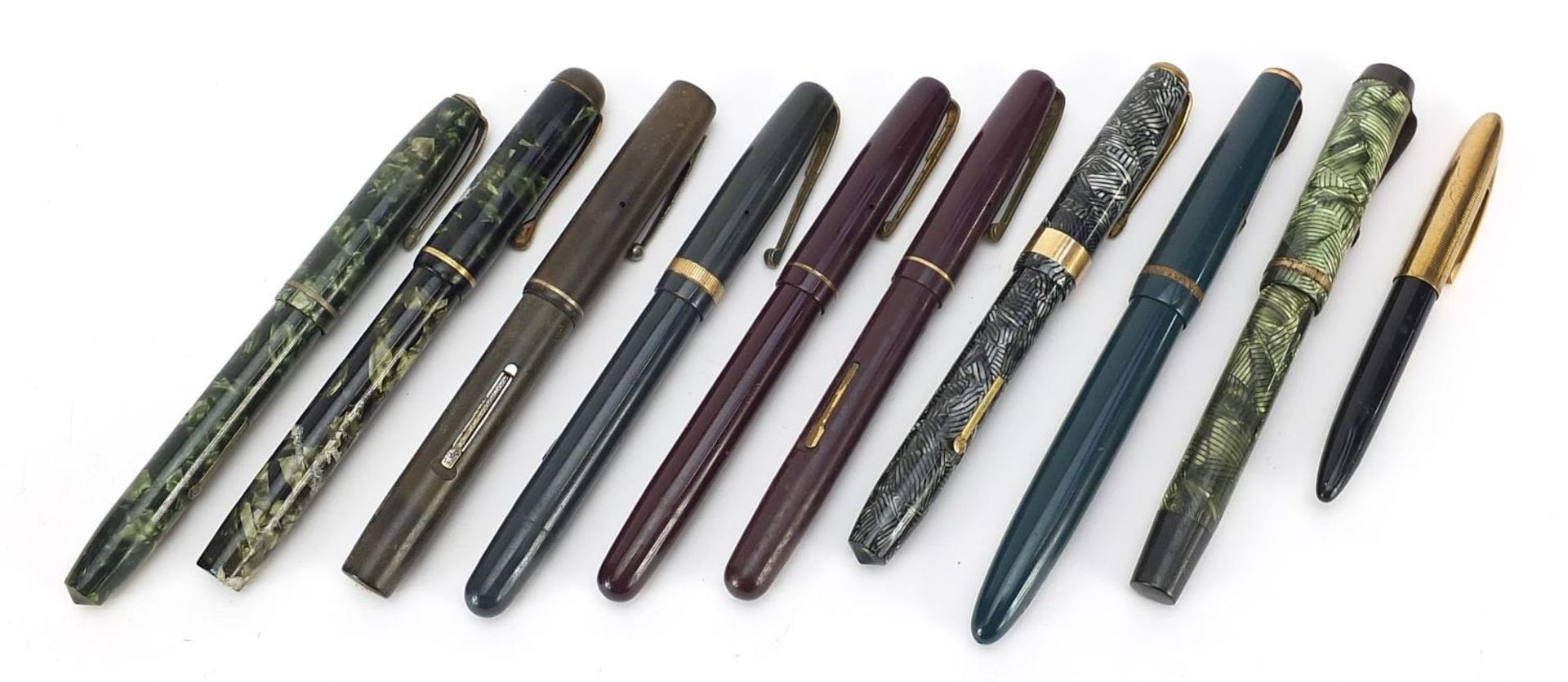 Ten vintage fountain pens with gold nibs, some marbleised including Watermans, Parker and Conway