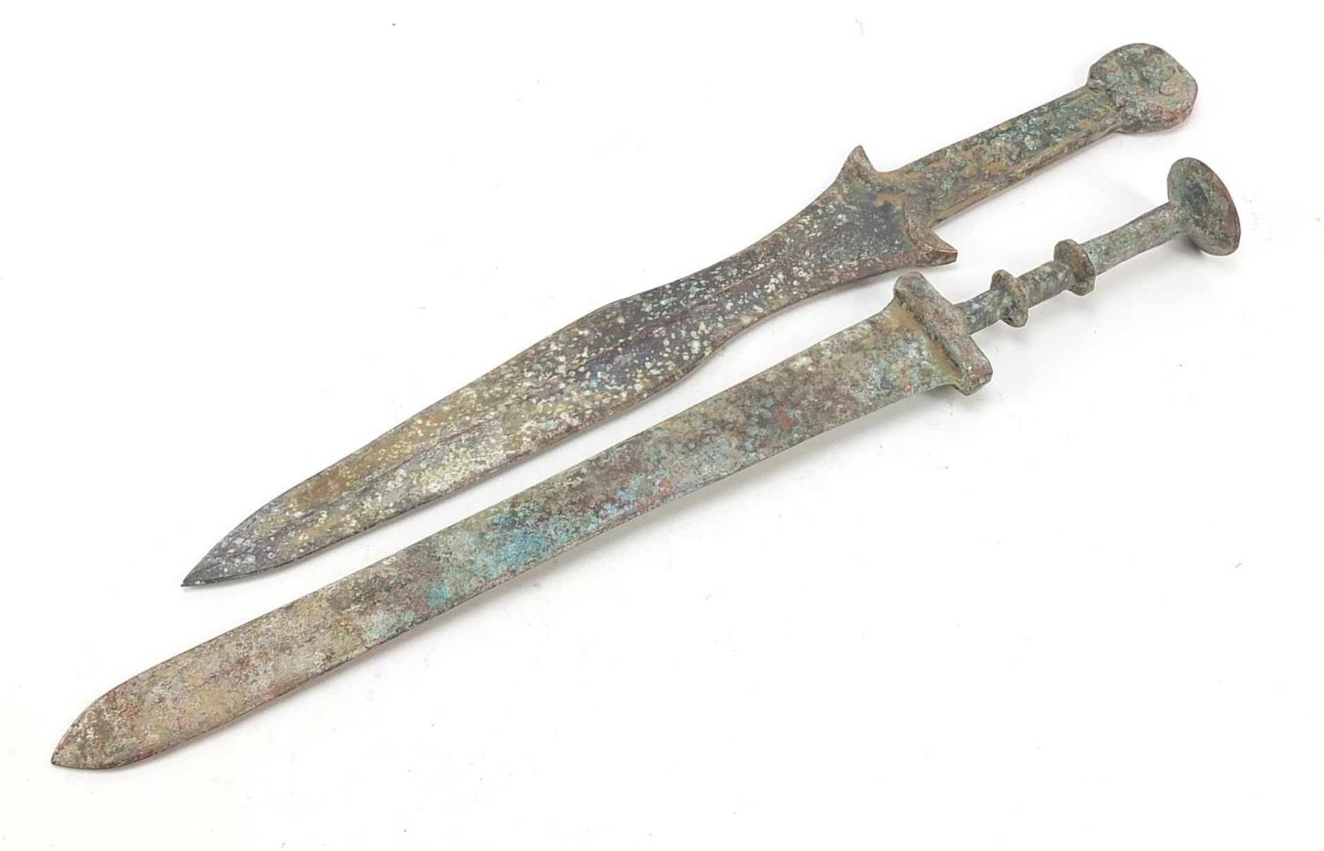 Two Chinese/Islamic patinated bronze short swords, the largest 39cm in length