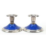 Pair of Norwegian silver and blue guilloche enamel candlesticks, each 7cm high, total 416.6g