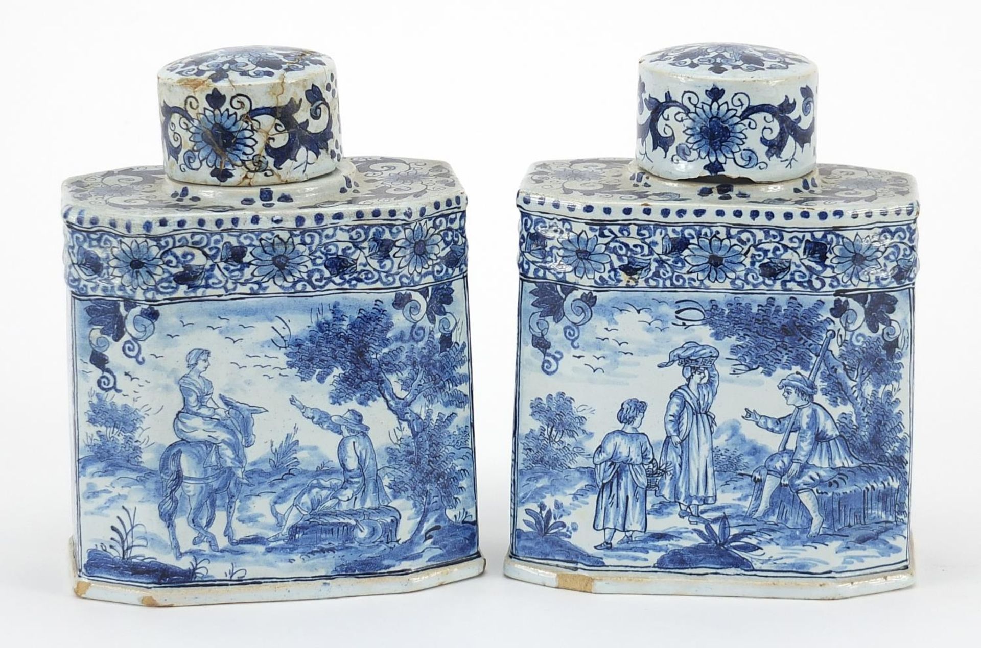 Pair of Delft tin glazed pottery tea caddies hand painted with traditional Dutch figures in