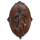 19th century German Black Forest hunting trophy plaque carved in relief with hanging game and birds,