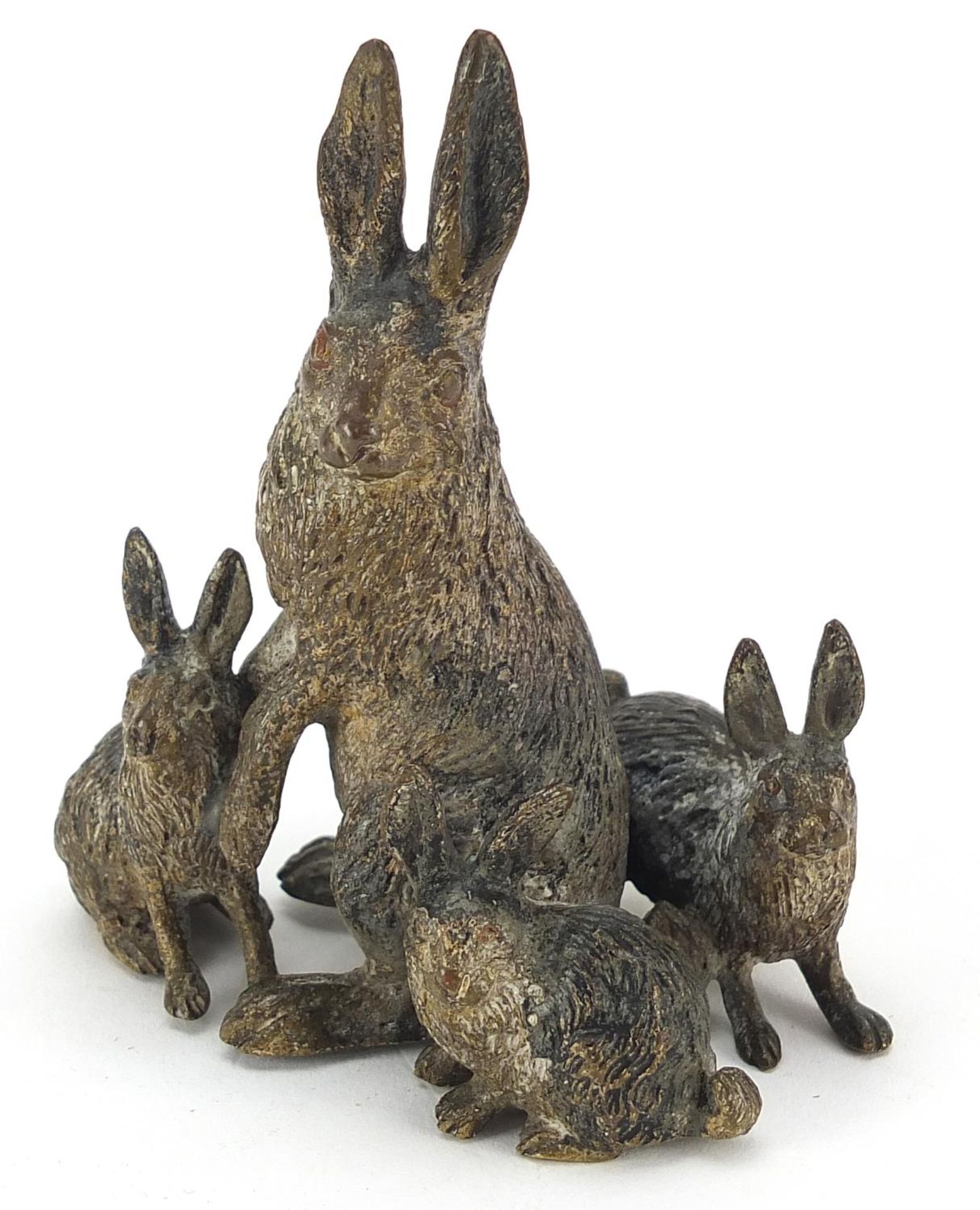 German cold painted bronze group of a hare and three bunnies, impressed Geschutzt to the base of