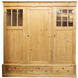Large pine three door wardrobe with drawers to the base, 189cm H x 186cm W x 60cm D