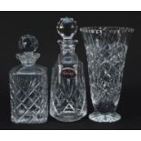 Two cut glass decanters with stoppers and cut glass vase, the largest 28.5cm high