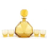 Amber art glass decanter with four glasses, the decanter 25cm high