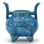 Japanese blue glazed porcelain koro decorated in relief with a bird, 17.5cm high
