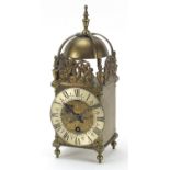 18th century style brass lantern clock with silvered chapter ring having Roman numerals retailed