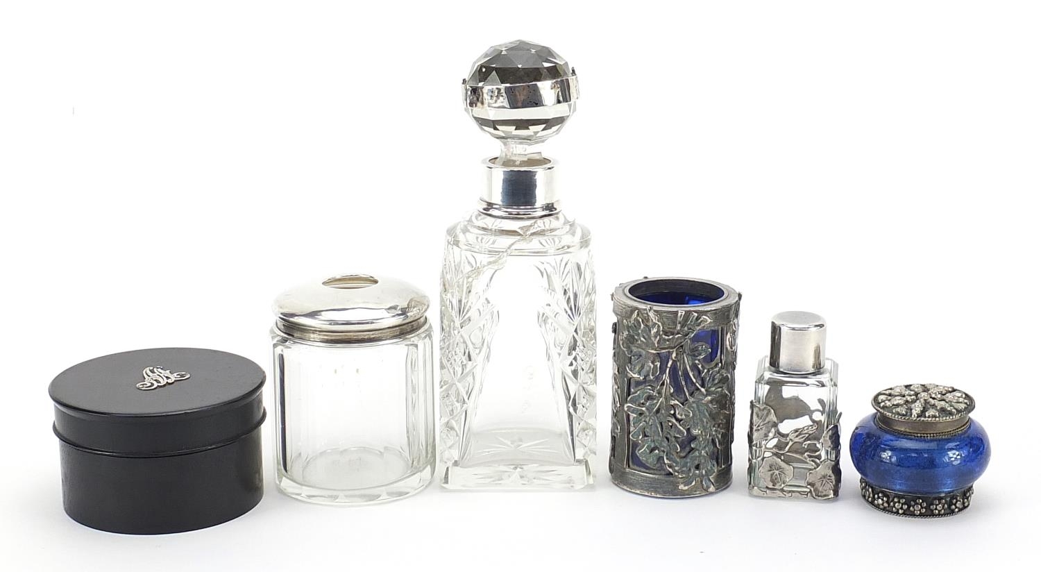 Six scent bottles and jars, some with silver mounts, the largest 17cm high