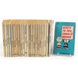 Twenty three vintage Charlie Brown soft back books by Charles N Schulz