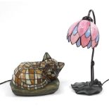 Two tiffany design leaded glass table lamps including one in the form of a sleeping cat, the largest