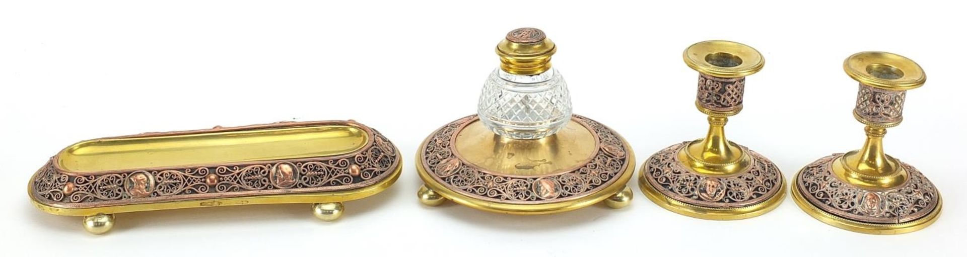 19th century continental gilt brass and copper desk set comprising a pen tray, inkwell and pair of