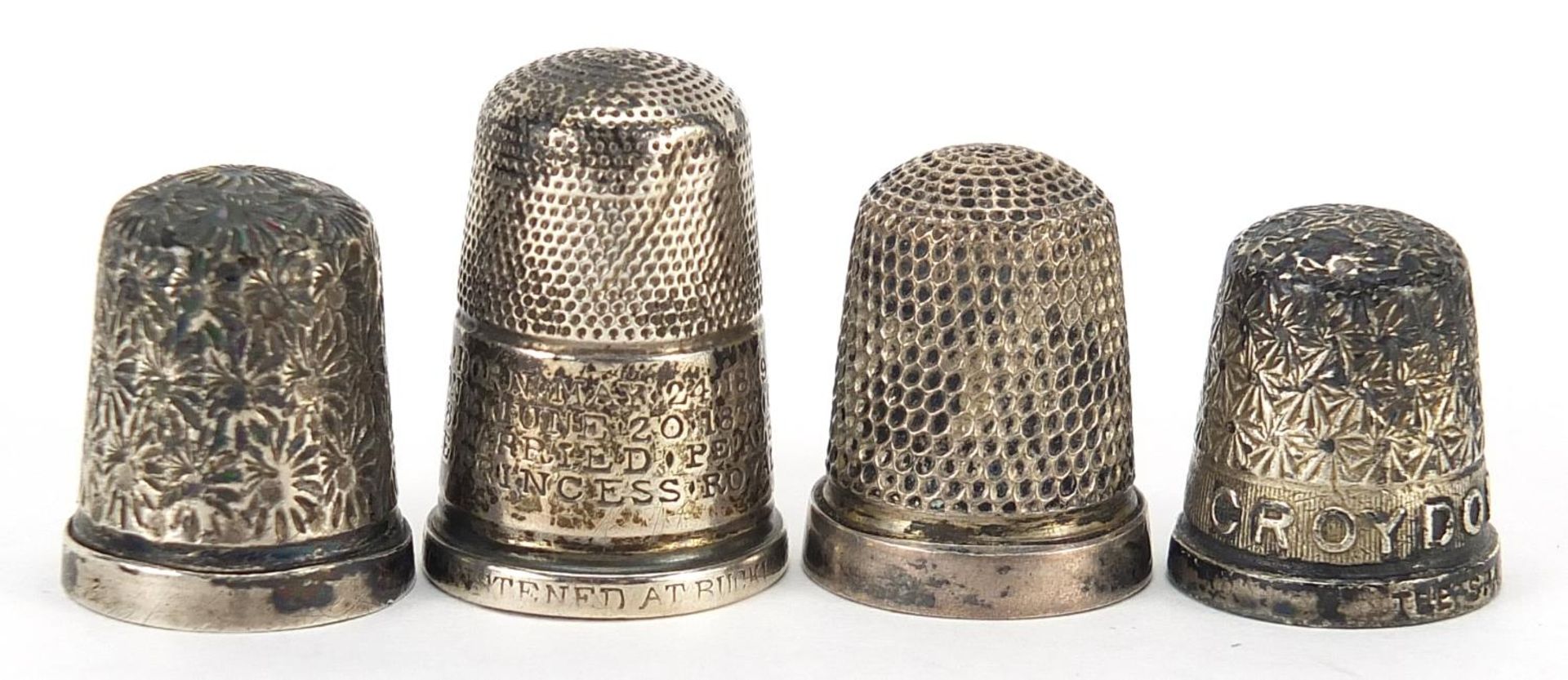 Four silver thimbles, the largest 2.5cm high, total 15.5g