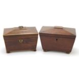 Two Victorian mahogany sarcophagus shaped tea caddies with twin divisional interiors, the largest