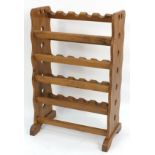 Naturalistic carved pine bottle rack, 120cm H x 66cm W x 40cm D