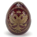 Russian red glass egg paperweight in the style of Faberge, etched with double headed eagle and