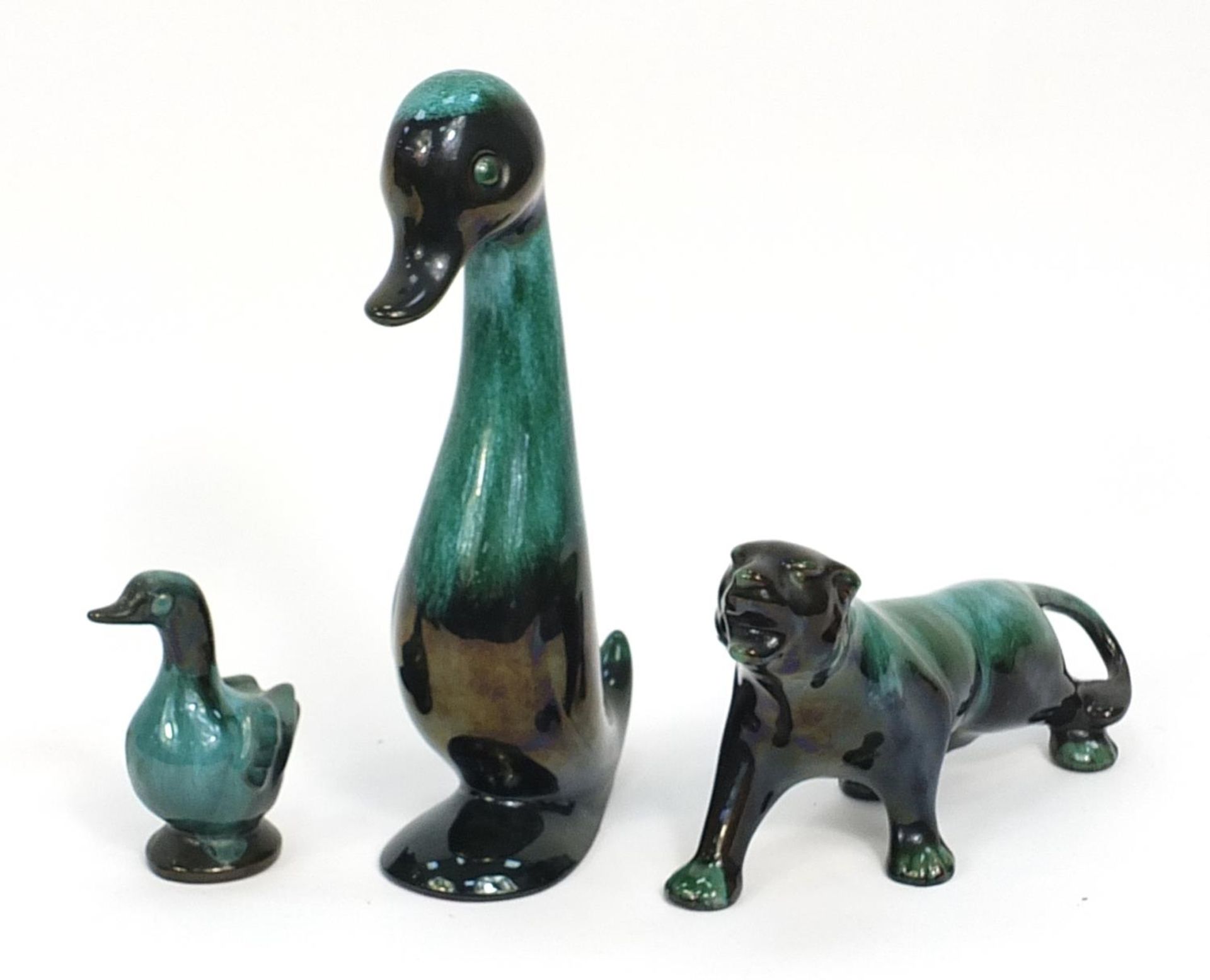 Blue mountain pottery ducks and a cougar, the largest 30cm high