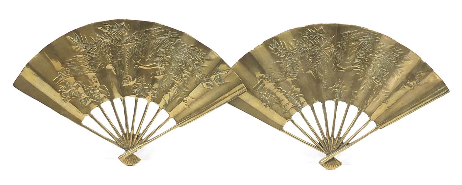 Pair of Chinese brass fans decorated with a bird of paradise, 18cm wide