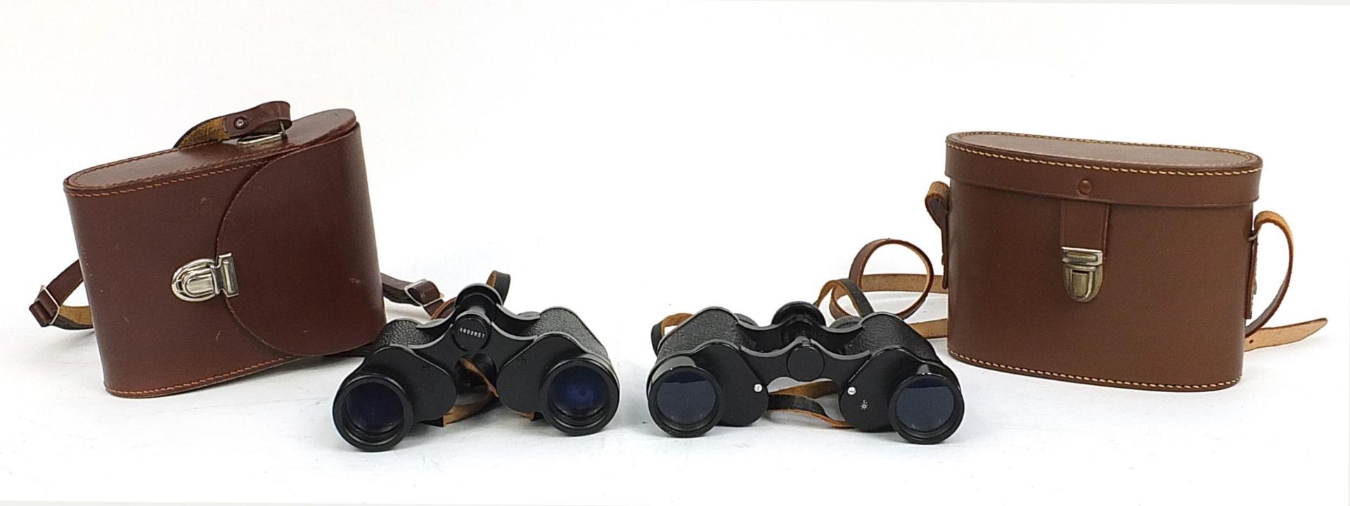 Cased pair of Depees Ltd 8x30 binoculars, London W1 and a pair of Carl Zeiss Jena binoculars with