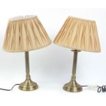 Pair of Dunelm brass coloured metal table lamps with fabric shades, each 50cm high