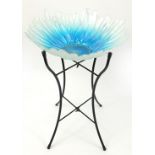 Glass flower top table on a black metal stand, 54cm H x 40cm in diameter