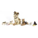 Collectable dogs including Bulldog, Terrier, Nao puppy on a sock and ceramic mother and puppy