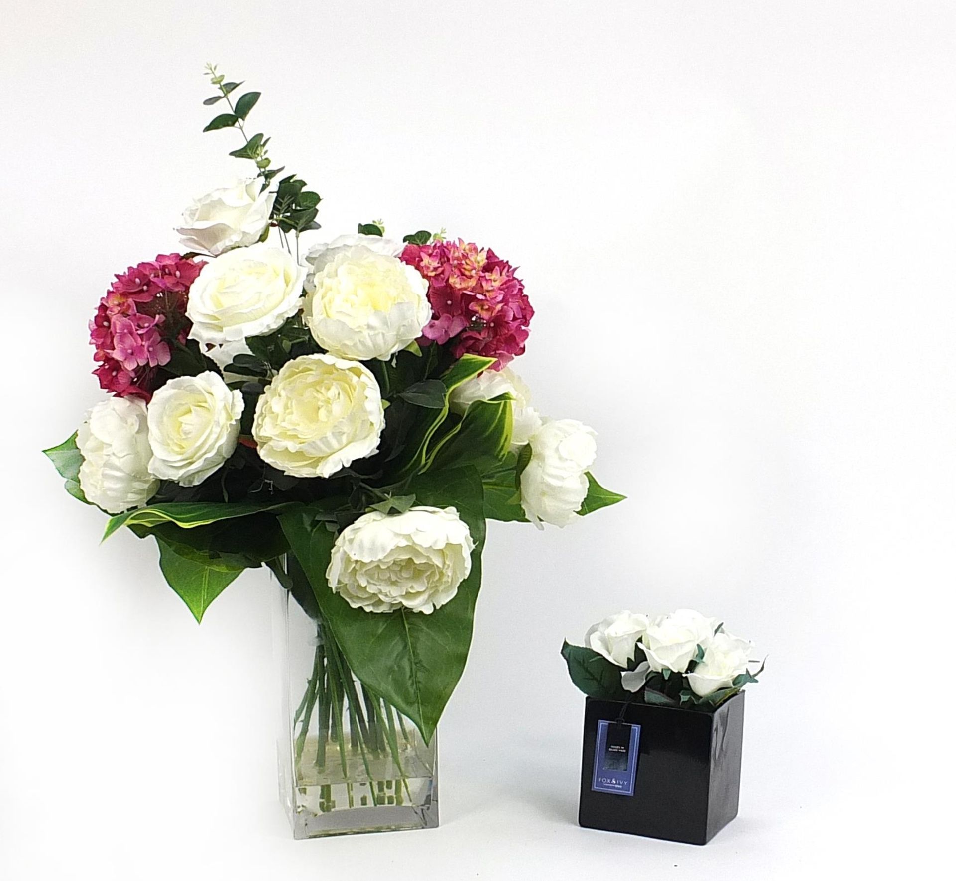 Glass vase artificial flower display of peonies and hydrangeas together with Fox & Ivy roses in a