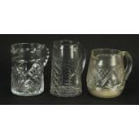 Three cut glass jugs, the largest 18cm high