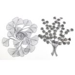 Two Metal floral wall hangings, the largest 65cms roumd