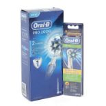 As new oral-B Pro 2000 electric toothbrush and pack of four brush heads