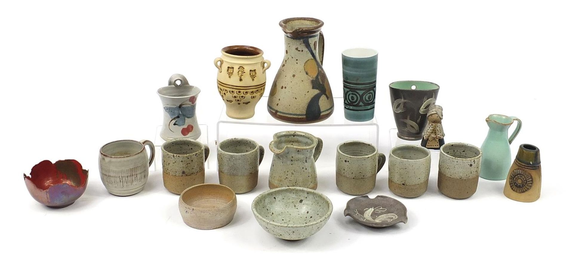 Studio pottery including vases, jugs and mugs, the largest 18cm high