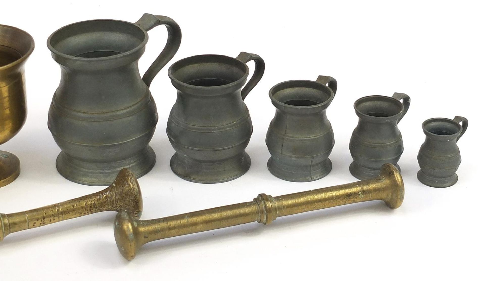 Three bronze pestle and mortars and set of five graduated pewter measures, the largest 24.5cm in - Image 3 of 3